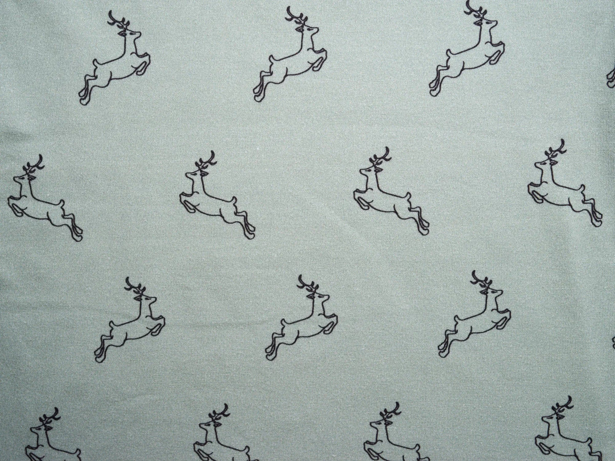 Uhuru Sage print detail — running gazelle print in soft sage