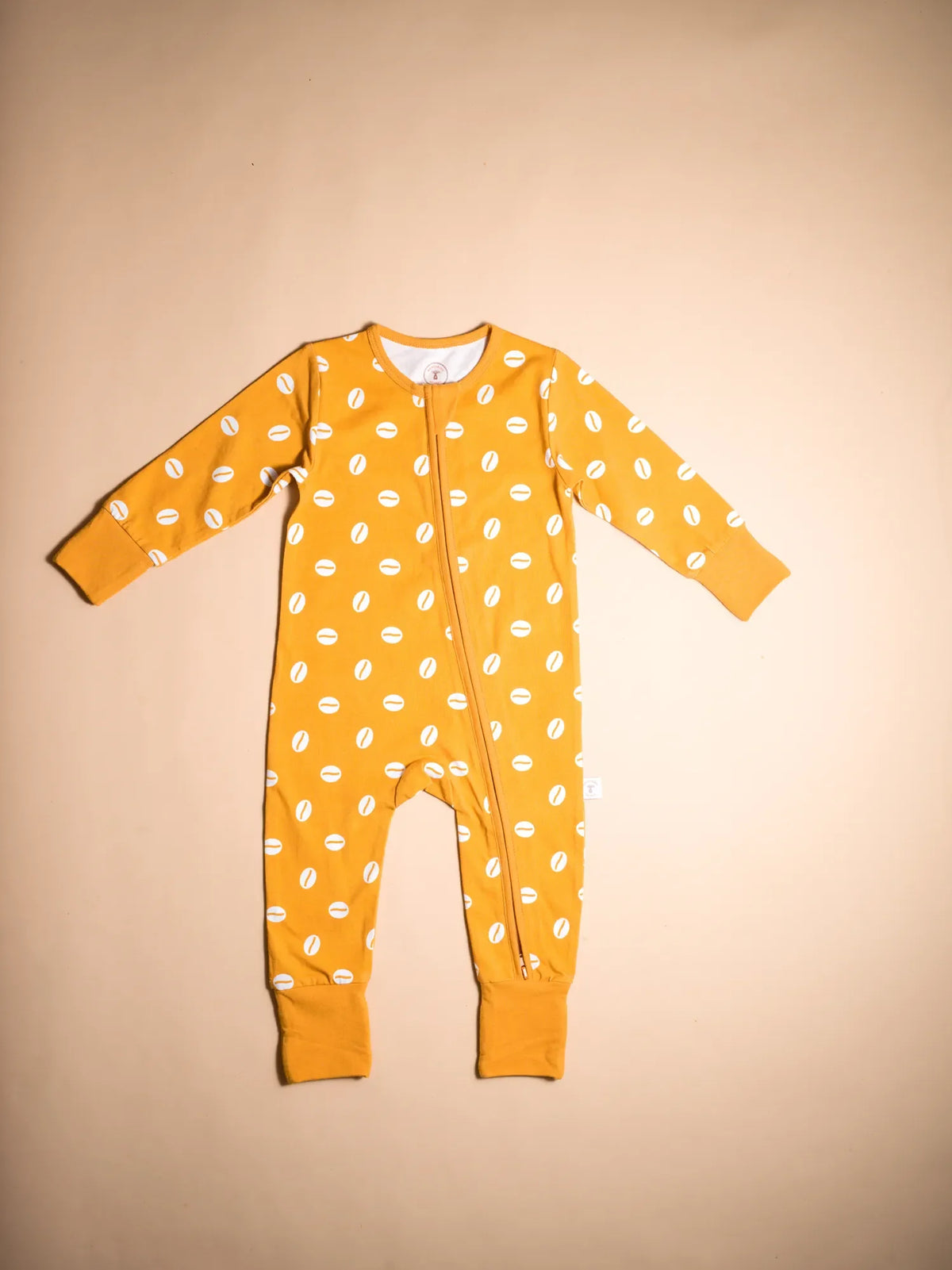 KendiKids Baraka Zipper Romper — cowrie shell print in white on golden mustard