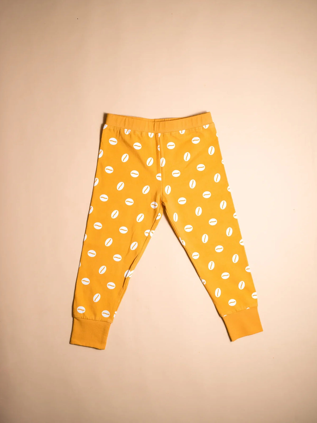 KendiKids Baraka Pajama Set — cowrie shell print in white on golden mustard