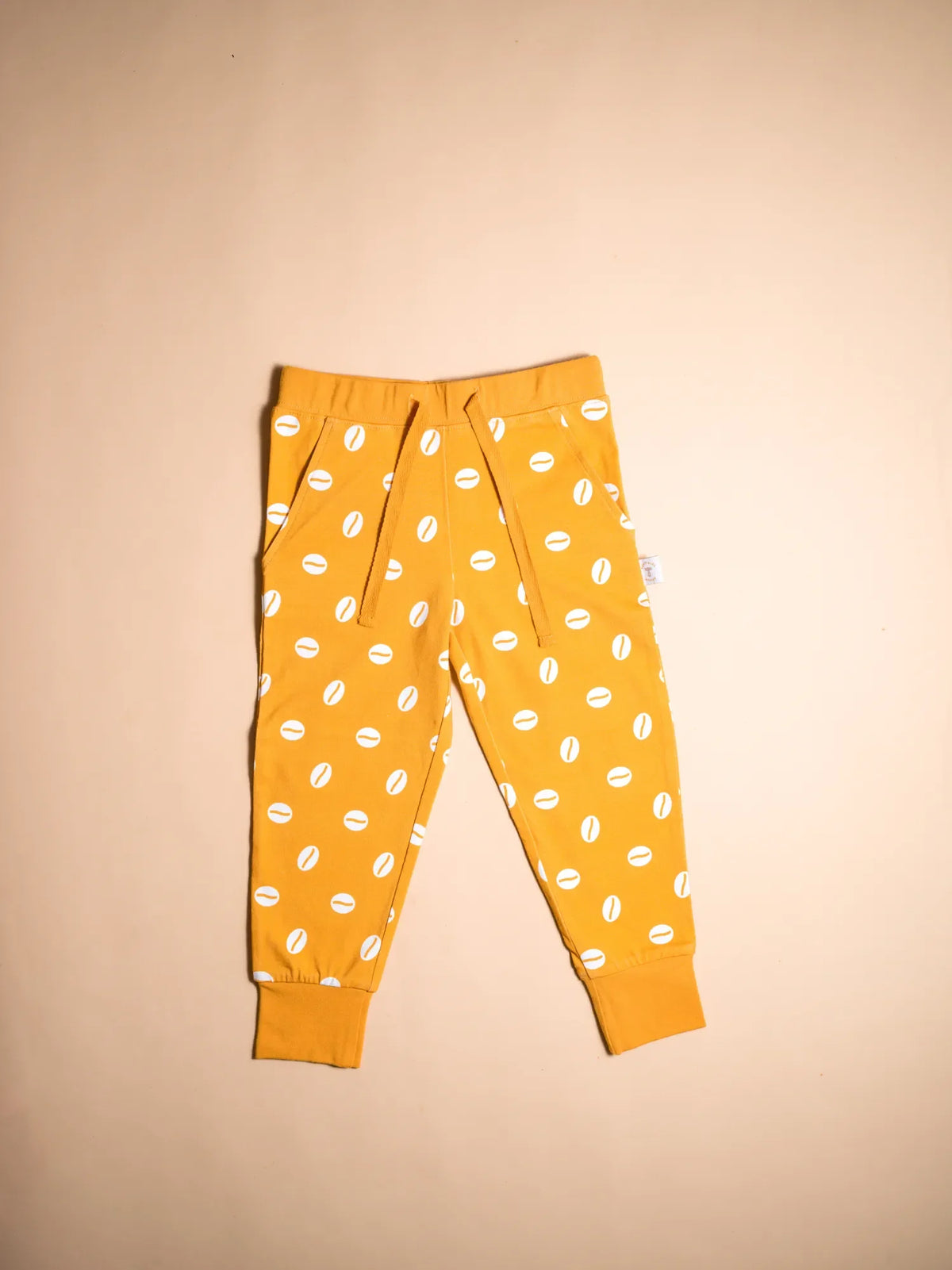 KendiKids Baraka Set — cowrie shell print in white on golden mustard