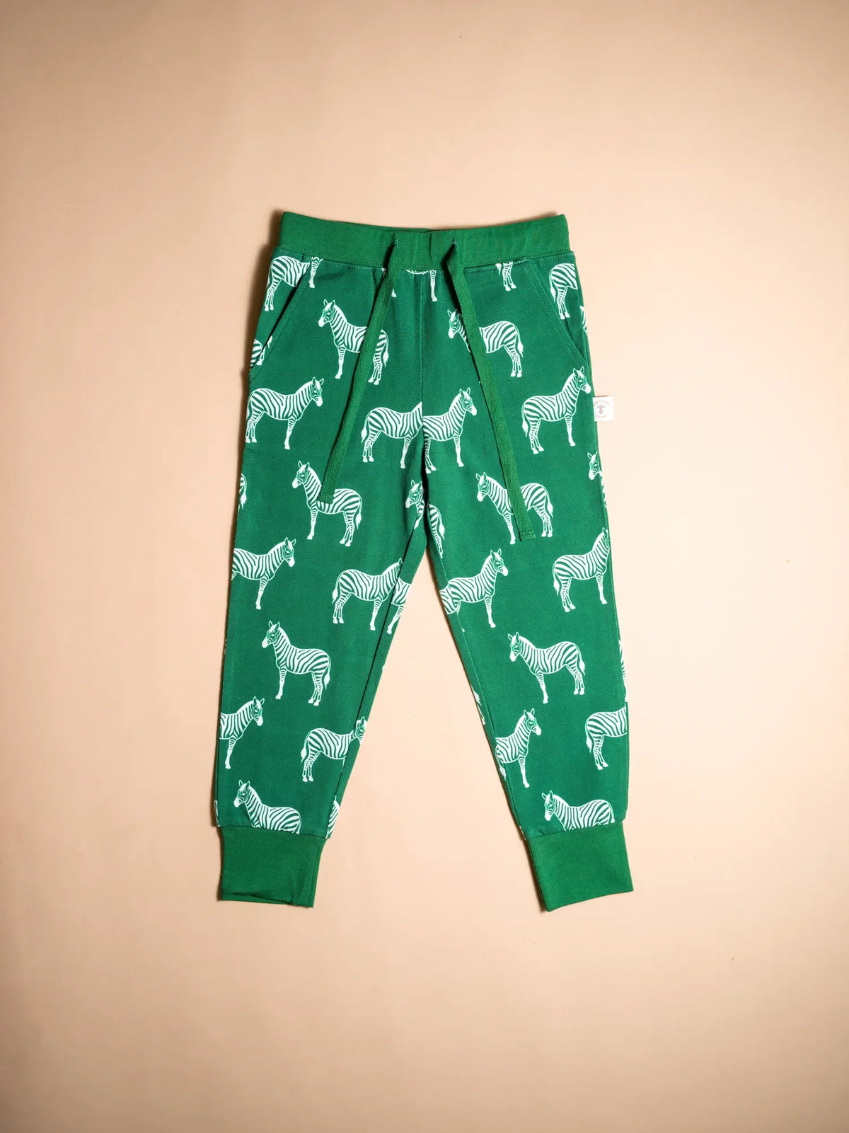 KendiKids Ndoto Joggers — zebra print in cream on forest green