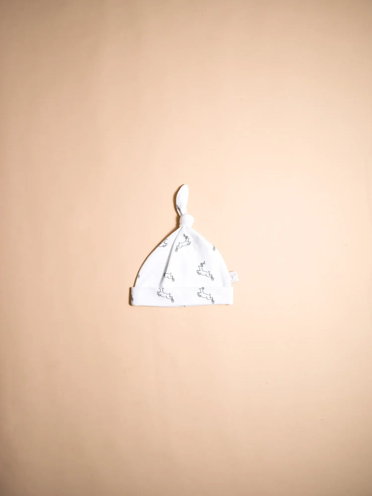 KendiKids Uhuru Knot Hat — running gazelle print in white
