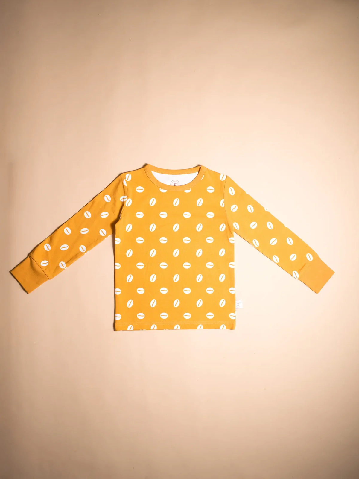 KendiKids Baraka Pajama Set — cowrie shell print in white on golden mustard