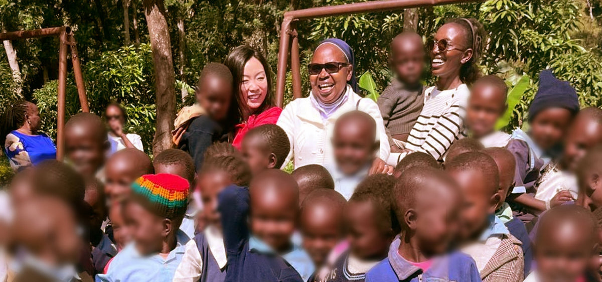 KendiKids founder Glory Kendi with Sister Lucy and friend Ginnie, surrounded by children at Good Shepherd in Meru, Kenya