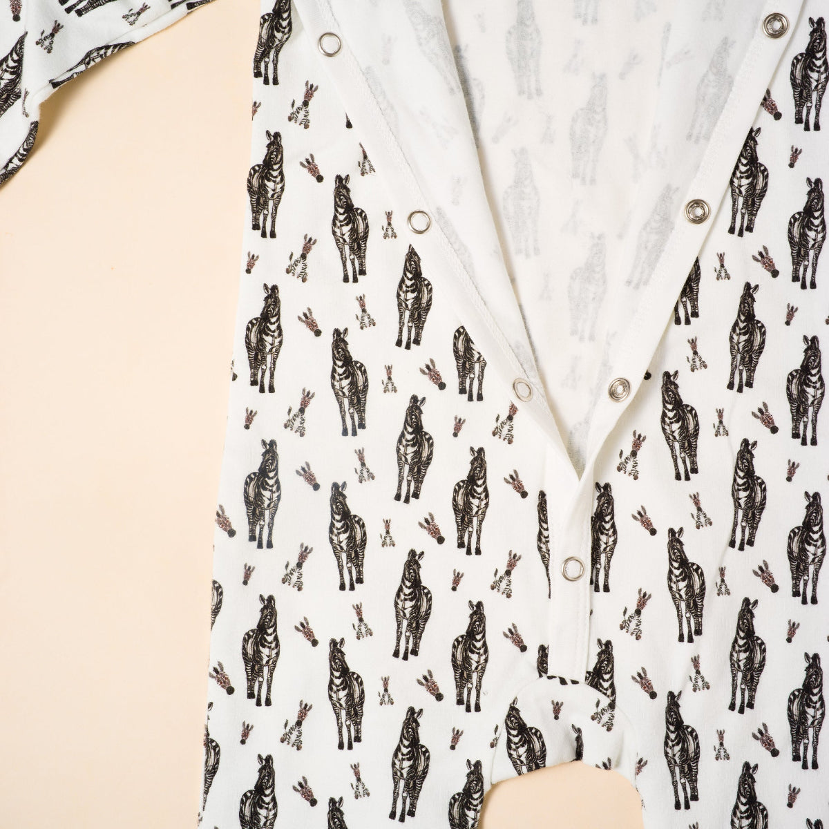 White shirt with zebra pattern worn by a person on a beige background